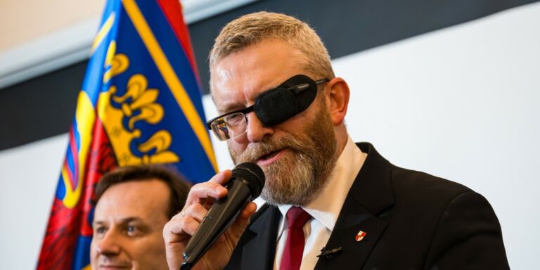 Braun’s party ban sparks Polish divide.